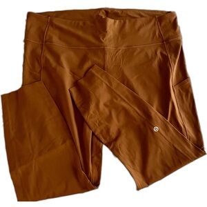 18 size LuluLemon rust orange leggings.